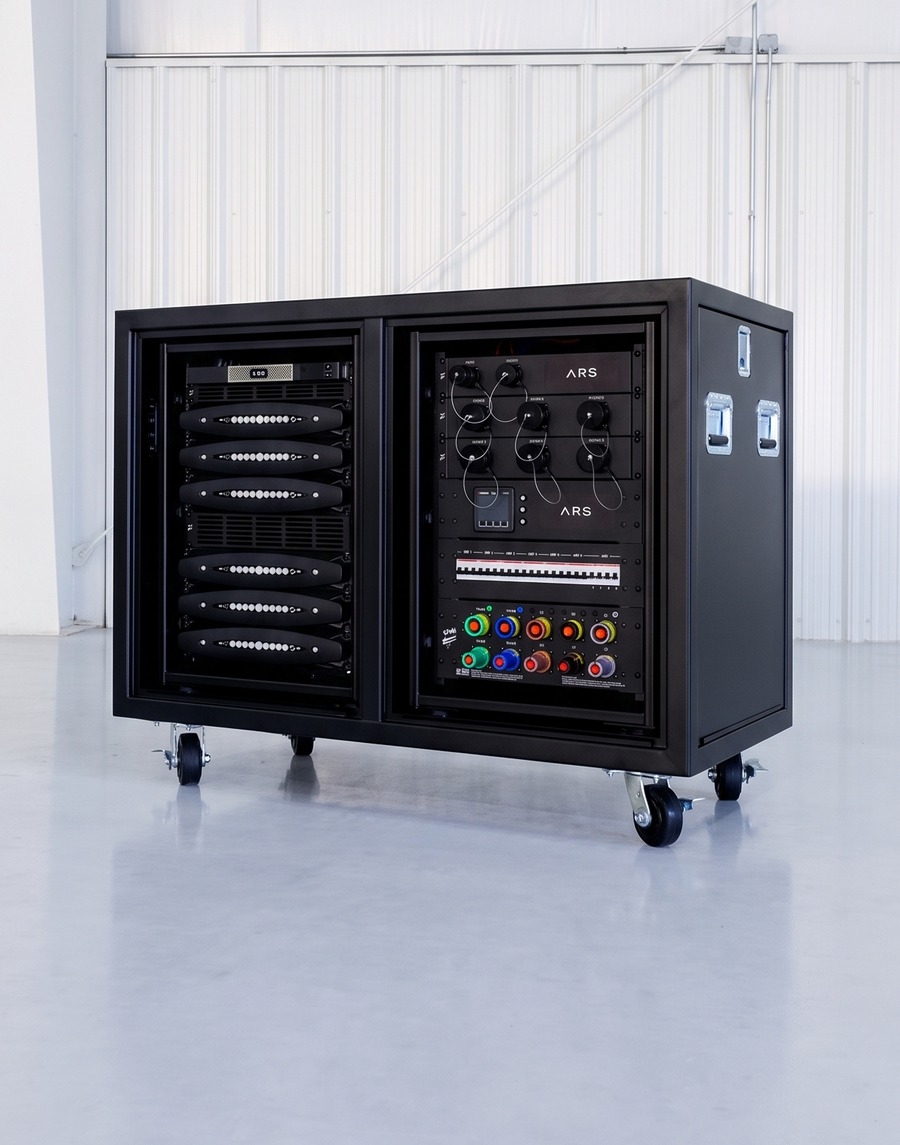 Black wheeled equipment cart with rack-mounted electronics, built and populated by Atlas
