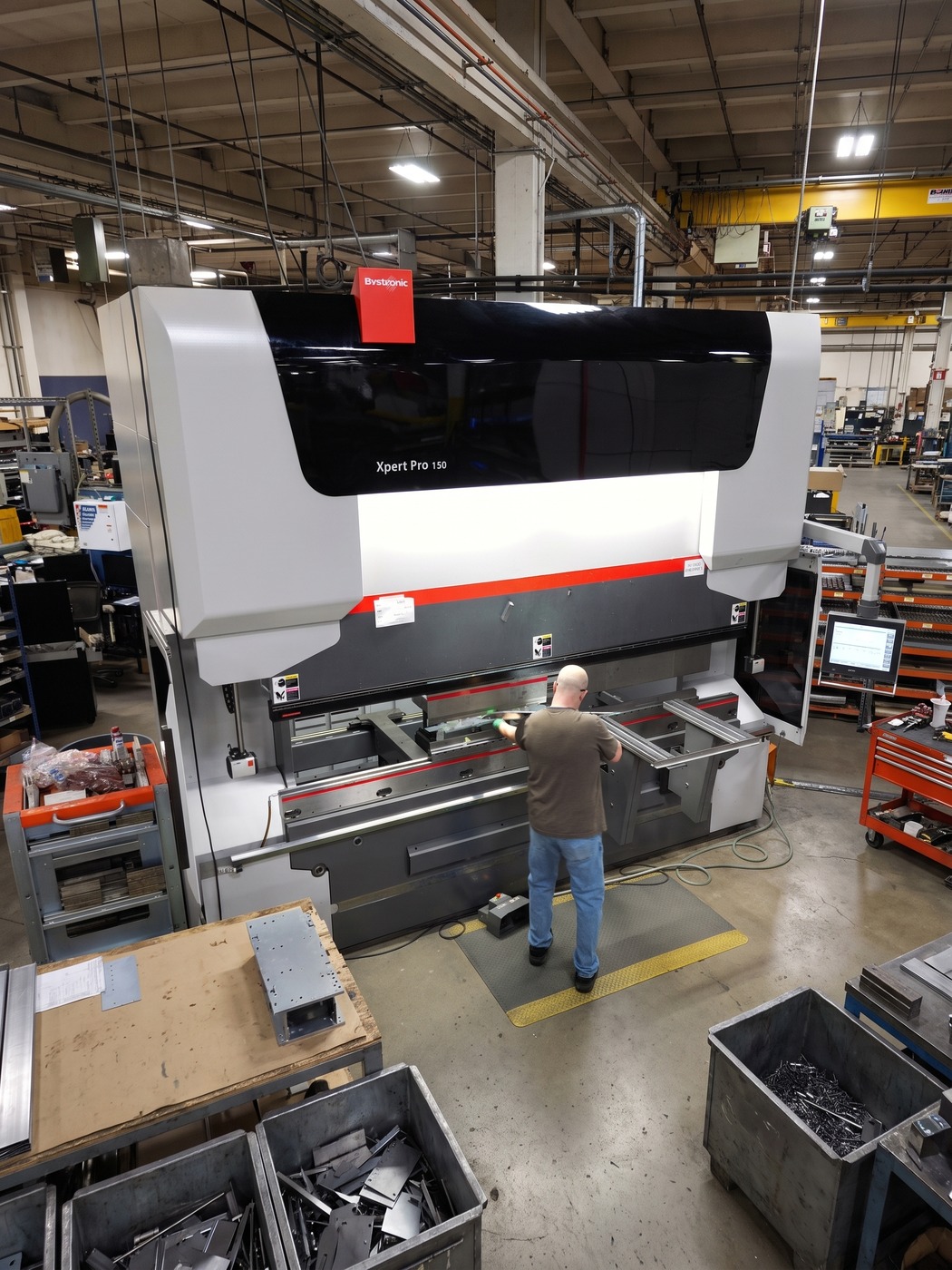 Operator running a Bystronic Xpert Pro press brake on the Atlas floor