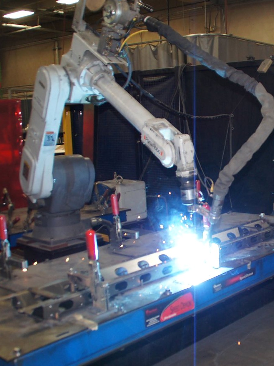 Robotic MIG welding cell running on the Atlas Manufacturing floor