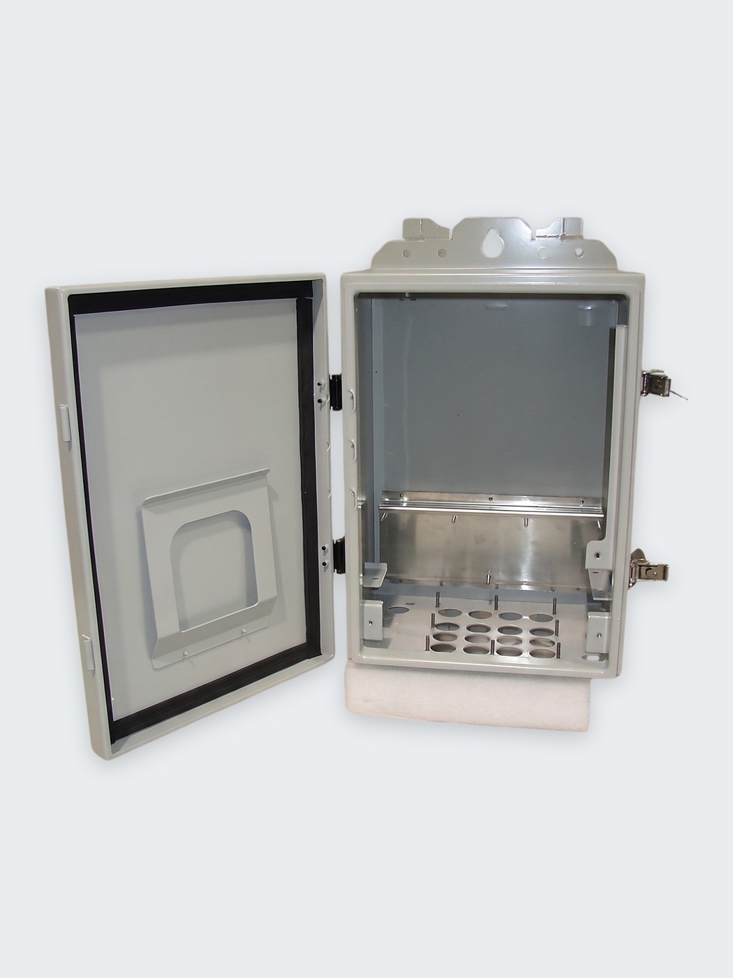 Finished enclosure with the door open, showing the gasket, hardware and interior sheet metal work